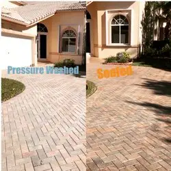 Project example showing a brick paver driveway labeled pressure washed and sealed
